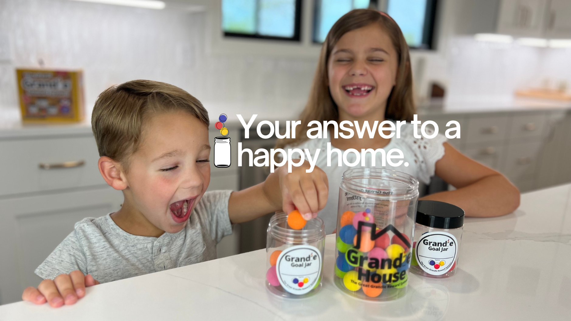 Child placing a Grandie into Grandie Goal Jar while another child watches happily.